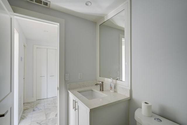 140 Lake Meryl Dr Unit 133, West Palm Beach, FL 33411 - half bath featuring marble look tile flooring, toilet, and vanity