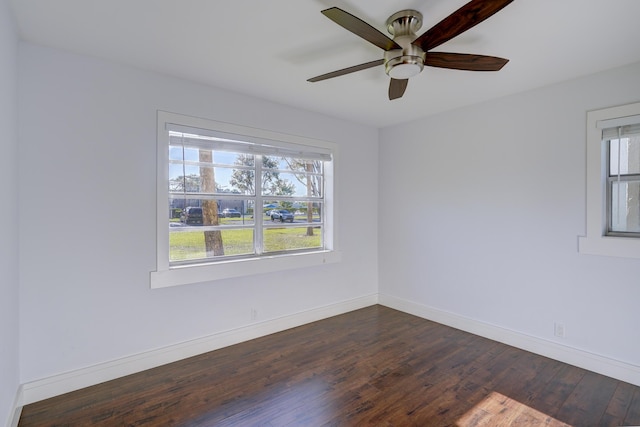 140 Lake Meryl Dr Unit 133, West Palm Beach, FL 33411 - empty room featuring dark wood-style flooring, baseboards, and a ceiling fan