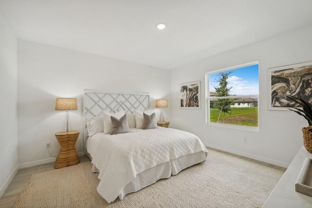 bedroom featuring recessed lighting and baseboards