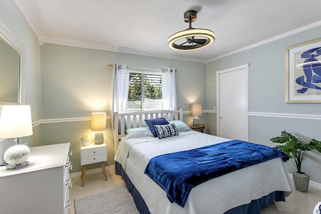 bedroom featuring light tile patterned floors, baseboards, and crown molding