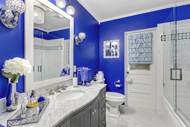bathroom featuring toilet, marble finish floor, crown molding, bath / shower combo with glass door, and vanity