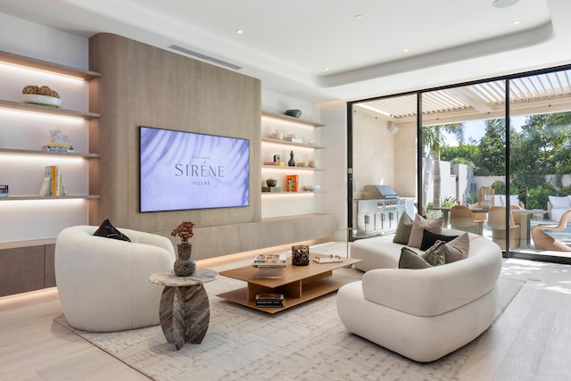 1246 George Bush, Delray Beach, FL 33483 - living room with a tray ceiling, recessed lighting, wood finished floors, and visible vents