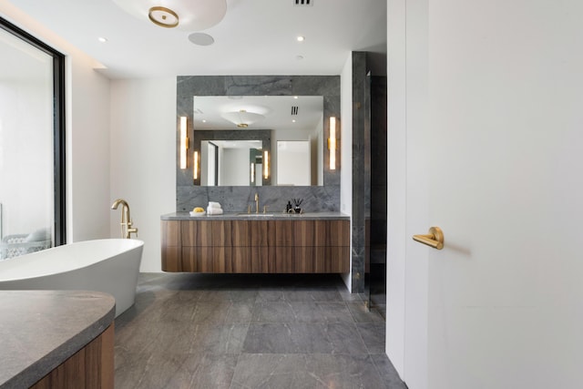 1246 George Bush, Delray Beach, FL 33483 - full bath featuring vanity, a freestanding tub, backsplash, and visible vents