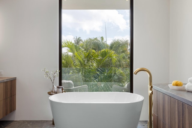 1246 George Bush, Delray Beach, FL 33483 - bathroom featuring a soaking tub and vanity