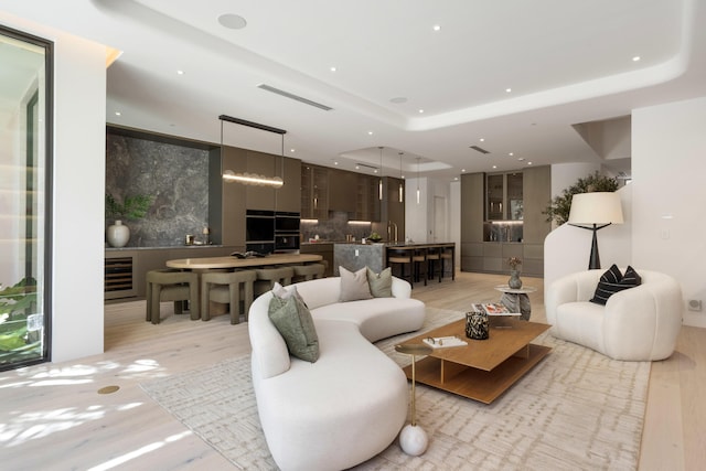 1246 George Bush, Delray Beach, FL 33483 - living room featuring beverage cooler, recessed lighting, light wood-style flooring, and visible vents