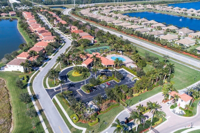 view of property location featuring a large body of water and nearby suburban area