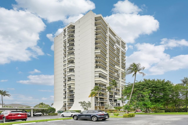 2400 Presidential Way Unit 302, West Palm Beach, FL 33401 - view of apartment building / complex featuring uncovered parking