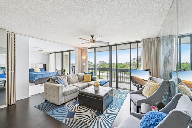 2400 Presidential Way Unit 302, West Palm Beach, FL 33401 - living area featuring ceiling fan, a textured ceiling, floor to ceiling windows, and wood finished floors