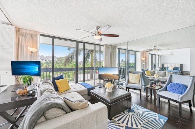 2400 Presidential Way Unit 302, West Palm Beach, FL 33401 - living area featuring ceiling fan, expansive windows, wood finished floors, and a textured ceiling