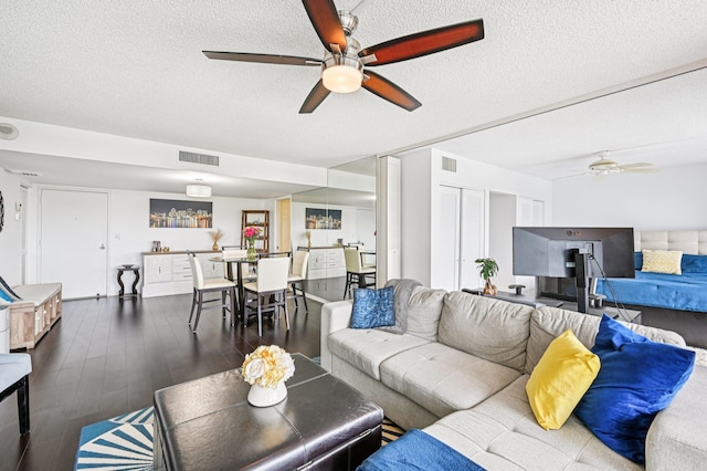 2400 Presidential Way Unit 302, West Palm Beach, FL 33401 - living room featuring a ceiling fan, a textured ceiling, and wood finished floors