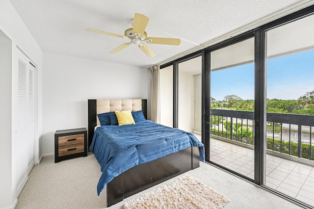 2400 Presidential Way Unit 302, West Palm Beach, FL 33401 - bedroom with carpet floors, multiple windows, access to exterior, and a textured ceiling