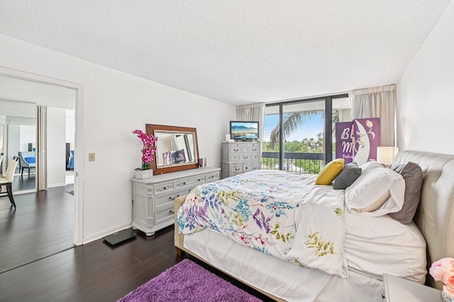 2400 Presidential Way Unit 302, West Palm Beach, FL 33401 - bedroom featuring access to exterior, dark wood-style floors, a textured ceiling, and baseboards