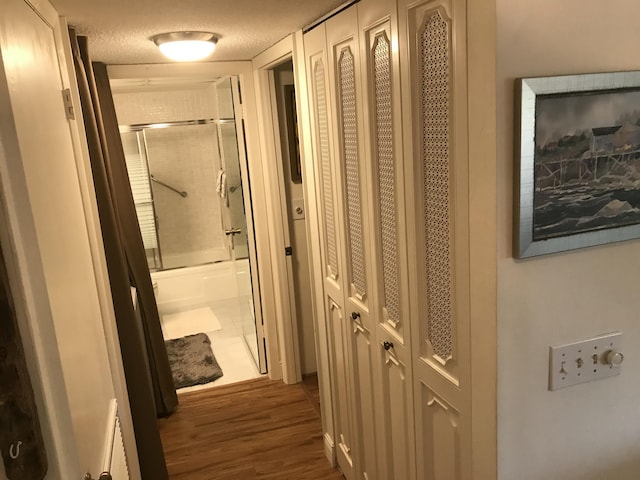 1800 SE Saint Lucie Blvd Unit 5203, Stuart, FL 34996 - hallway with wood finished floors and a textured ceiling