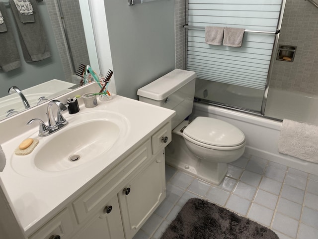 1800 SE Saint Lucie Blvd Unit 5203, Stuart, FL 34996 - full bath with tile patterned flooring, bath / shower combo with glass door, vanity, and toilet