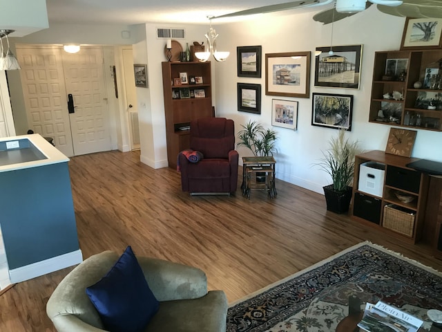 1800 SE Saint Lucie Blvd Unit 5203, Stuart, FL 34996 - living area with wood finished floors, baseboards, and a chandelier