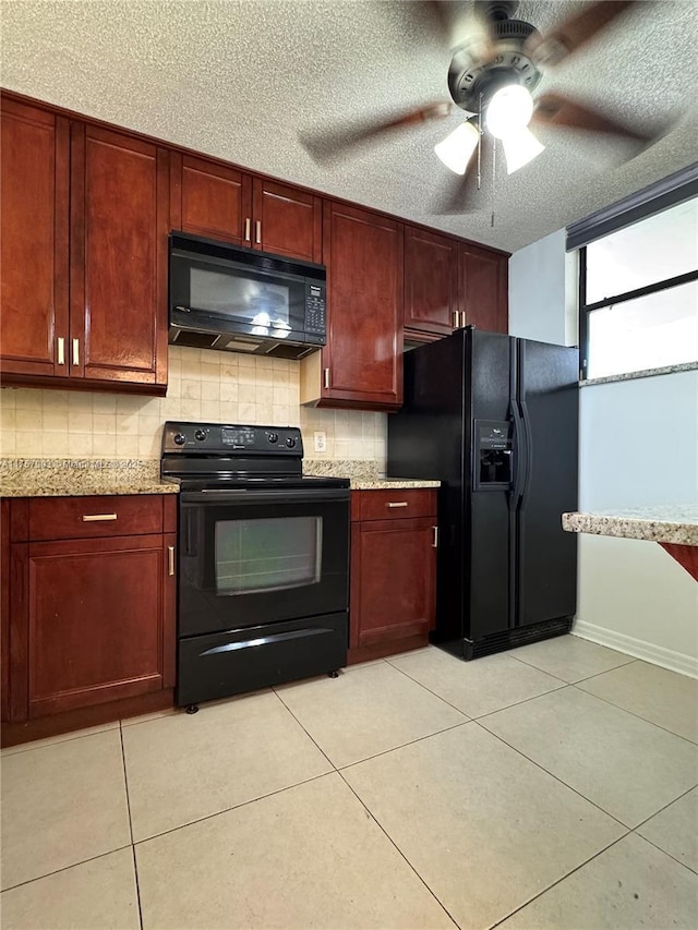 kitchen featuring tasteful backsplash, light tile patterned floors, black appliances, and ceiling fan