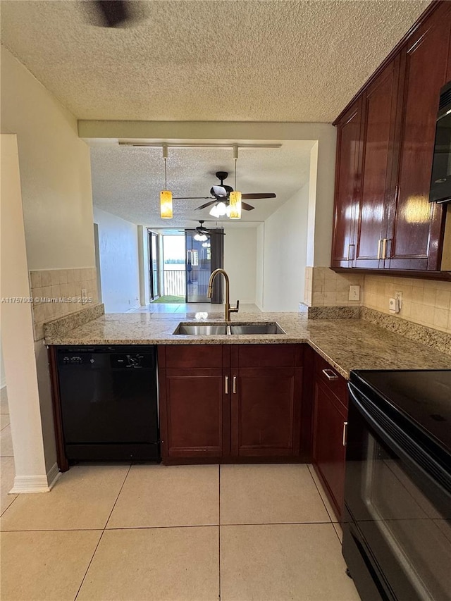 kitchen with light stone countertops, a sink, black appliances, and light tile patterned flooring