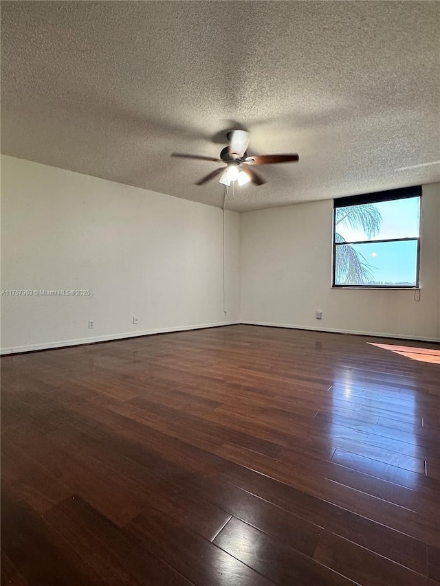 unfurnished room featuring a textured ceiling, baseboards, hardwood / wood-style floors, and ceiling fan
