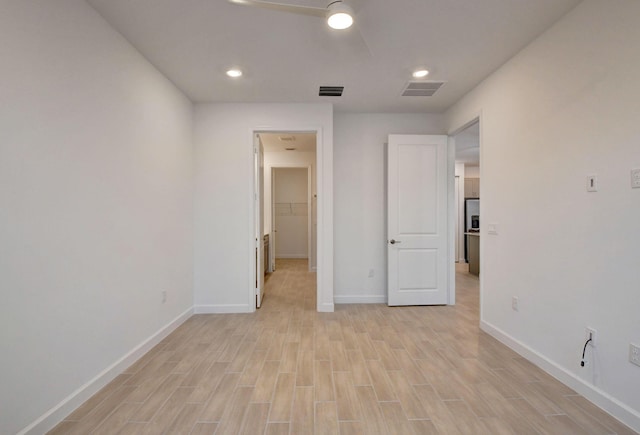6975 Peters Ln, Delray Beach, FL 33446 - unfurnished bedroom with visible vents, baseboards, and light wood-style floors