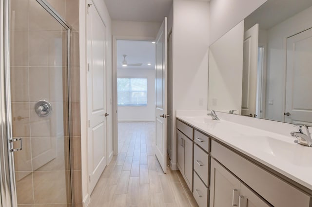 6975 Peters Ln, Delray Beach, FL 33446 - bathroom featuring a shower stall, double vanity, and a sink