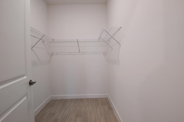 6975 Peters Ln, Delray Beach, FL 33446 - spacious closet with light wood-style floors