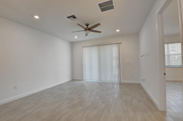 6975 Peters Ln, Delray Beach, FL 33446 - unfurnished room with a ceiling fan, visible vents, light wood finished floors, and baseboards