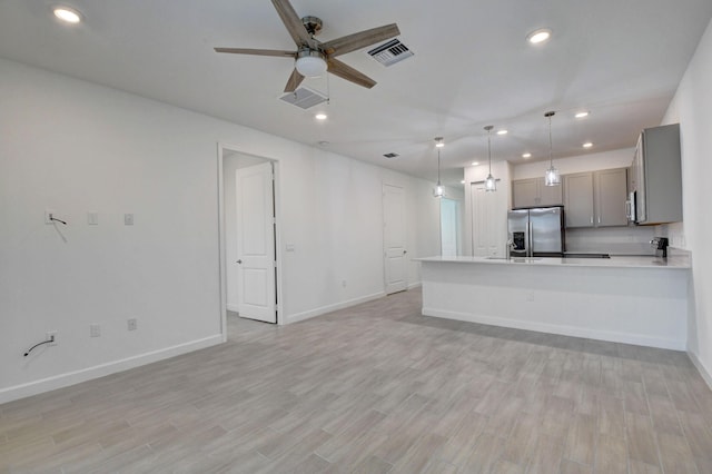 6975 Peters Ln, Delray Beach, FL 33446 - unfurnished living room featuring visible vents, baseboards, ceiling fan, recessed lighting, and light wood-style flooring