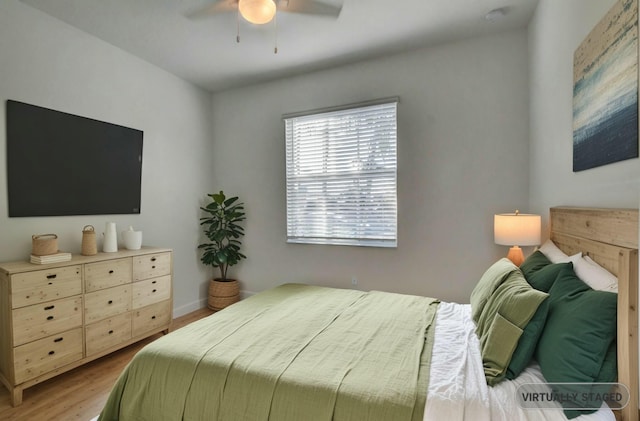 6975 Peters Ln, Delray Beach, FL 33446 - bedroom featuring ceiling fan, baseboards, and wood finished floors