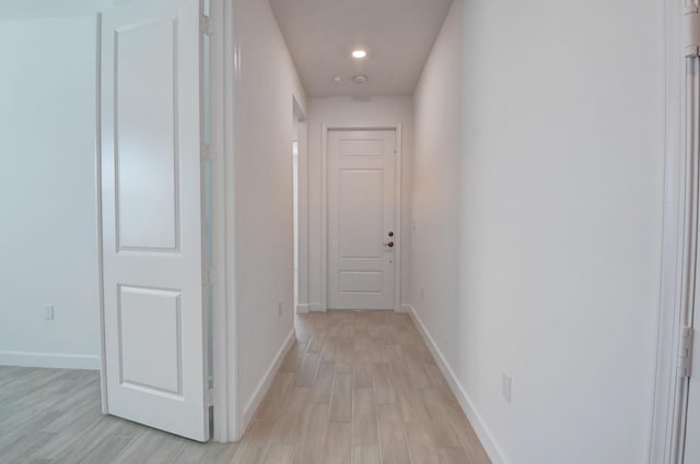 6975 Peters Ln, Delray Beach, FL 33446 - hallway featuring baseboards and light wood-style flooring