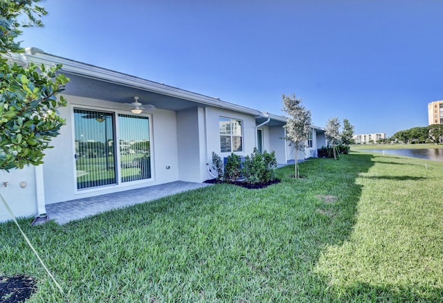 6975 Peters Ln, Delray Beach, FL 33446 - view of yard featuring a ceiling fan and a water view