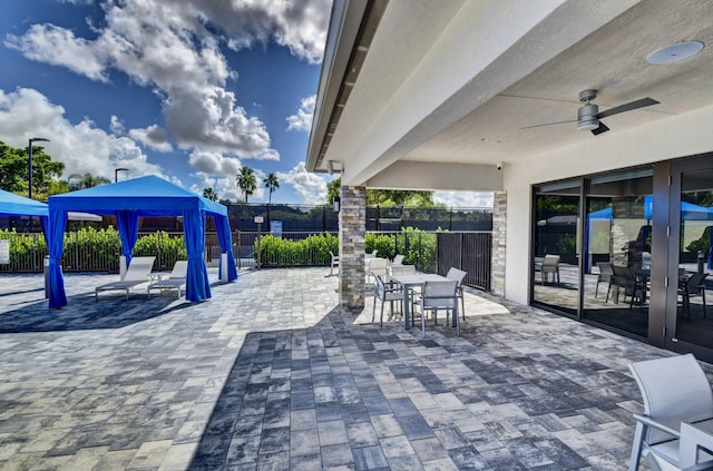 6975 Peters Ln, Delray Beach, FL 33446 - view of patio / terrace with outdoor dining area, a ceiling fan, and fence