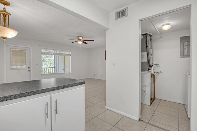 436 Pine Glen Ln Unit C-2, Greenacres, FL 33463 - kitchen featuring electric panel, light tile patterned floors, a ceiling fan, and visible vents