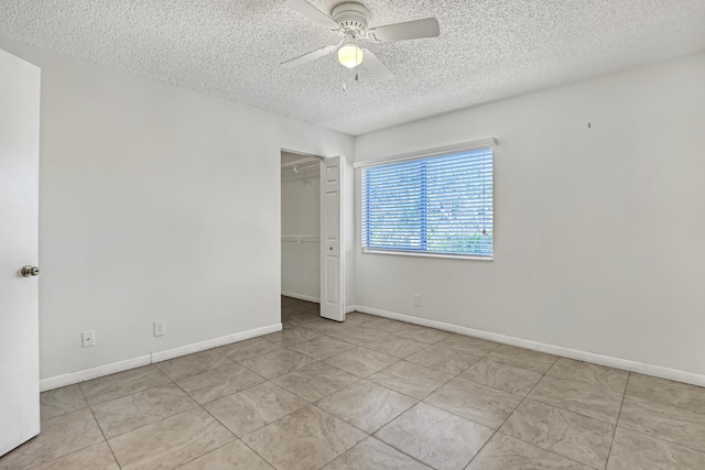 436 Pine Glen Ln Unit C-2, Greenacres, FL 33463 - unfurnished room featuring tile patterned floors, baseboards, a textured ceiling, and ceiling fan