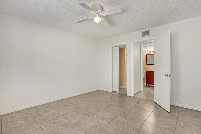 436 Pine Glen Ln Unit C-2, Greenacres, FL 33463 - unfurnished bedroom featuring visible vents, ceiling fan, a textured ceiling, and baseboards