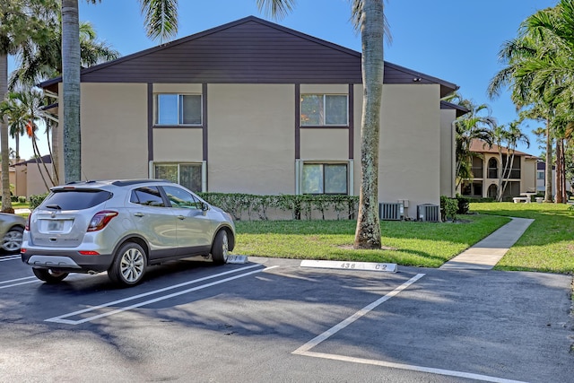436 Pine Glen Ln Unit C-2, Greenacres, FL 33463 - view of property featuring uncovered parking