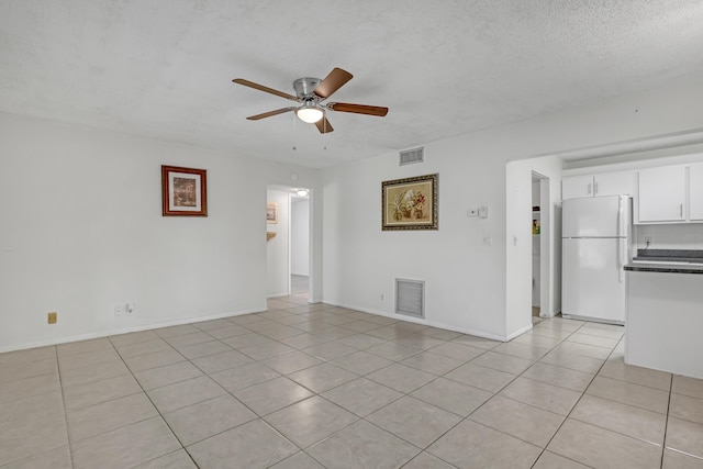 436 Pine Glen Ln Unit C-2, Greenacres, FL 33463 - empty room with light tile patterned flooring, a ceiling fan, visible vents, and a textured ceiling