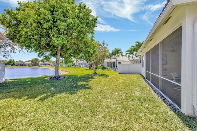 2737 Clipper Cir, West Palm Beach, FL 33411 - view of grassy yard featuring a water view, a residential view, and a sunroom