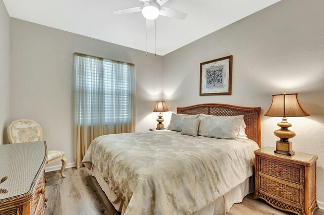 2737 Clipper Cir, West Palm Beach, FL 33411 - bedroom featuring light wood finished floors, baseboards, and a ceiling fan