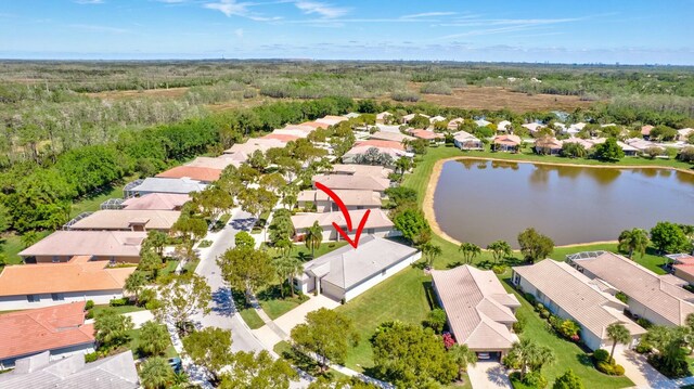 2737 Clipper Cir, West Palm Beach, FL 33411 - aerial view of residential area with a large body of water and a heavily wooded area