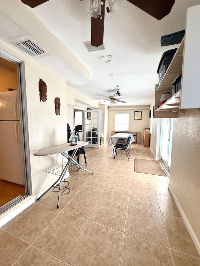 434 SE Doat St, Port Saint Lucie, FL 34983 - interior space featuring baseboards, ceiling fan, visible vents, and tile patterned floors