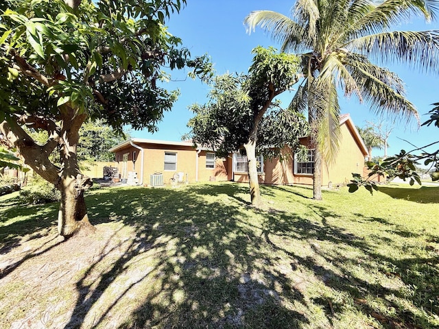 434 SE Doat St, Port Saint Lucie, FL 34983 - view of yard with central AC unit