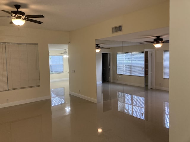 1112 Wild Cherry Ln, Wellington, FL 33414 - empty room featuring visible vents, baseboards, and ceiling fan