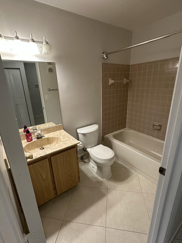 full bathroom featuring tile patterned floors, toilet,  shower combination, and vanity