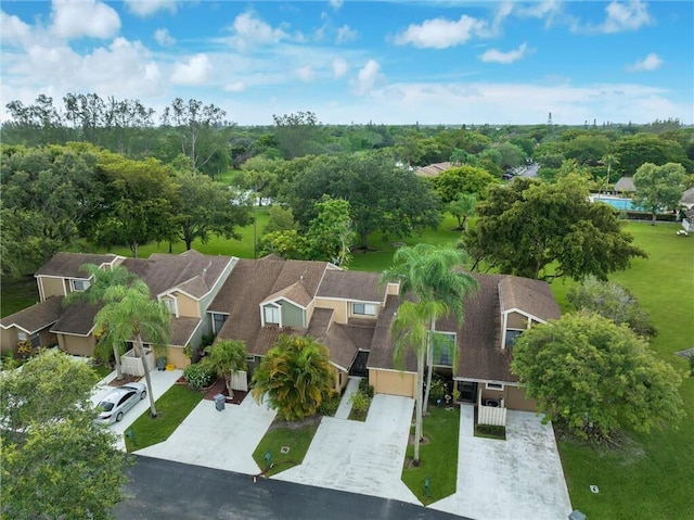 birds eye view of property with a residential view