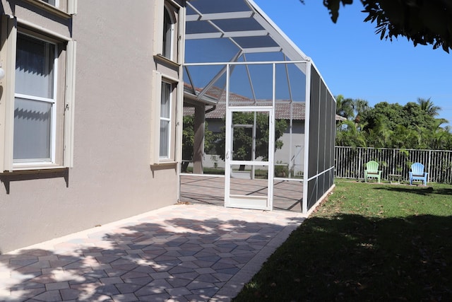 view of patio with a lanai
