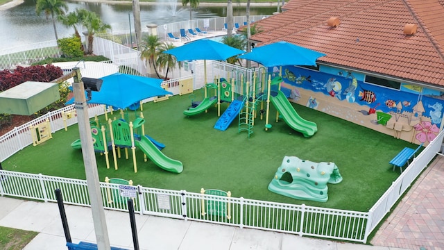 community play area with fence and a water view