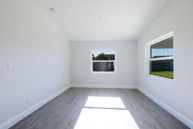 2372 SW Import Dr, Port Saint Lucie, FL 34953 - empty room with baseboards and wood finished floors
