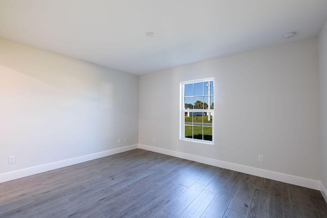 2372 SW Import Dr, Port Saint Lucie, FL 34953 - unfurnished room with dark wood-style floors and baseboards