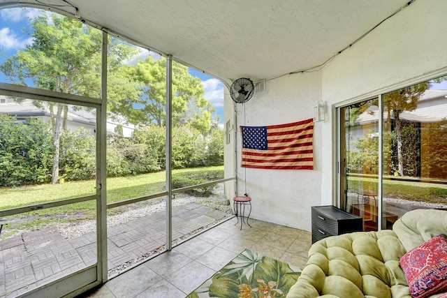 unfurnished sunroom featuring a healthy amount of sunlight