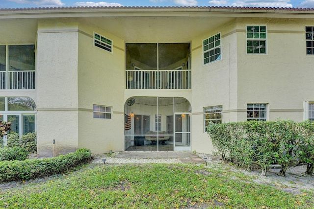 back of property with stucco siding